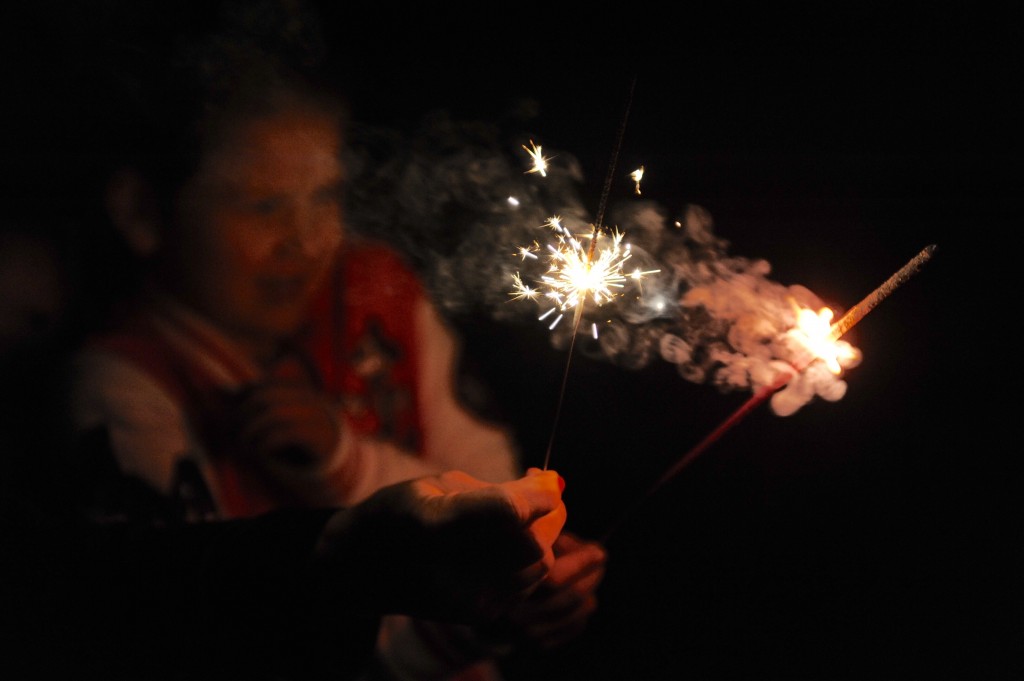 A girl with sparklers at the birthday party
