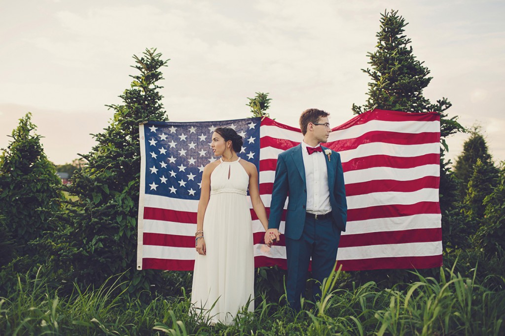 American flag as backdrop for July 4th wedding