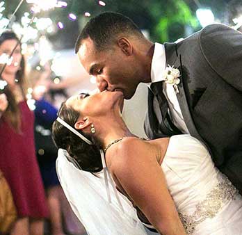 Couple kissing bending left